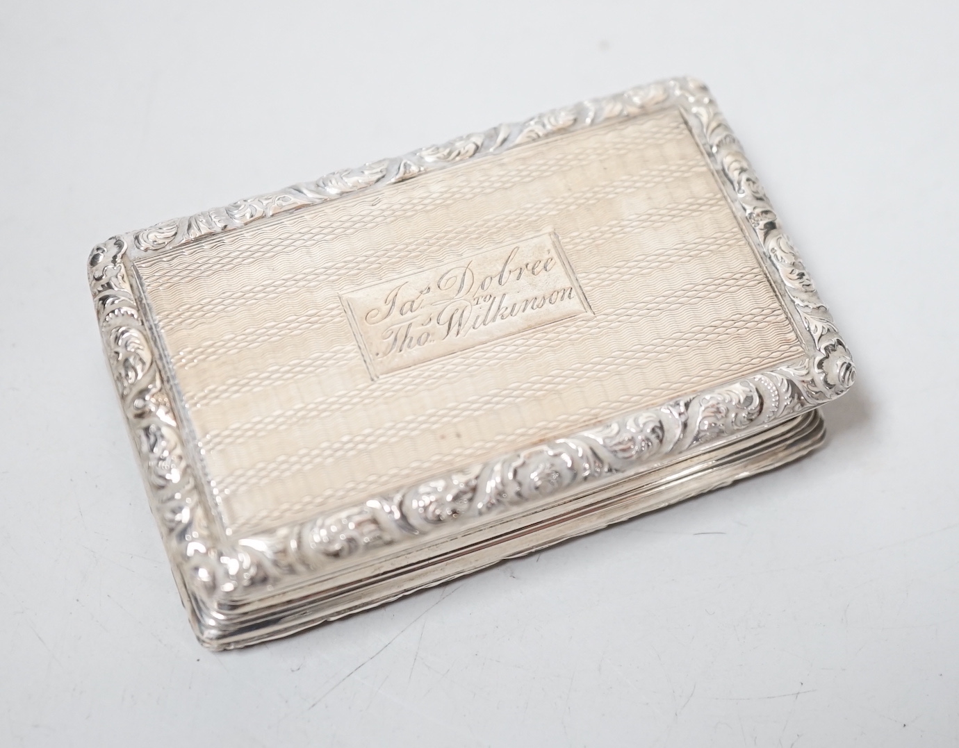 A George IV engine turned silver rectangular snuff box, with engraved inscription, Thomas Shaw?, Birmingham, 1823, 73mm.